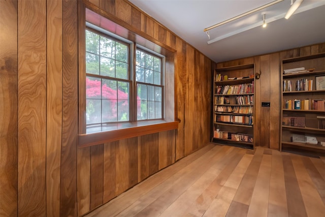 19 Reynal Rd, White Plains, NY 10605 - unfurnished room with wooden walls, built in features, and light wood-style floors