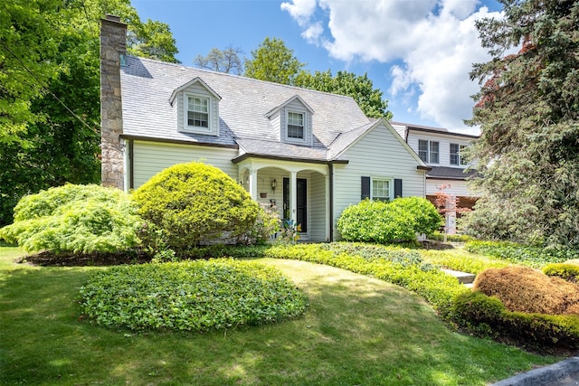 19 Reynal Rd, White Plains, NY 10605 - cape cod-style house featuring a chimney and a front yard