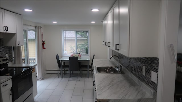 21 Hammond St, Monticello, NY 12701 - kitchen featuring electric range, a sink, backsplash, recessed lighting, and baseboard heating