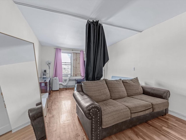 living room featuring light wood-style floors and baseboards