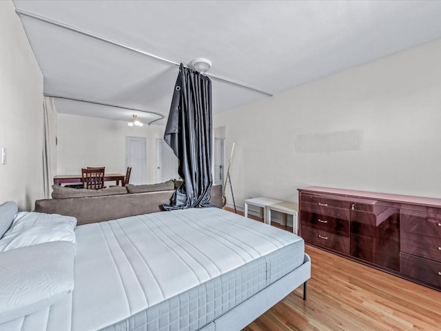 bedroom with light wood-style floors