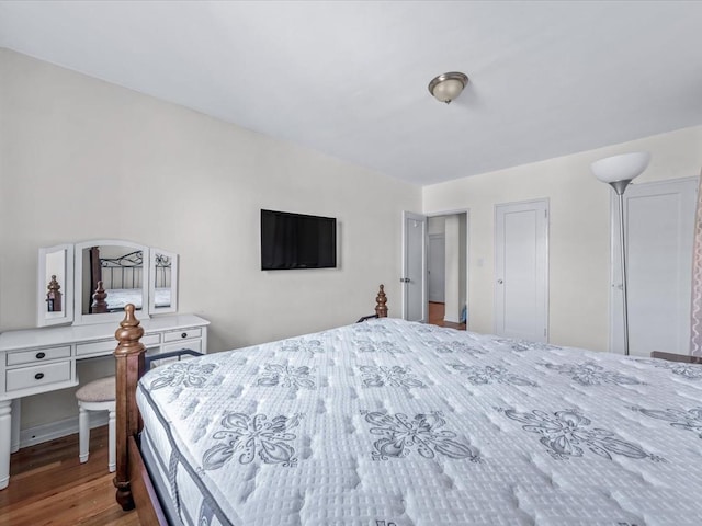 bedroom with wood finished floors