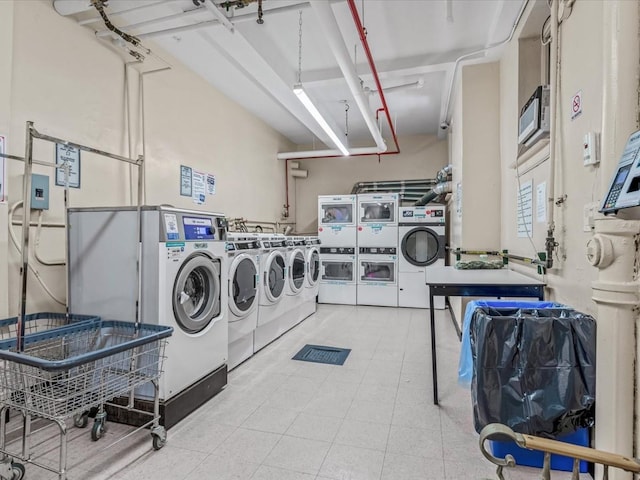 shared laundry with washer and clothes dryer and stacked washer and clothes dryer