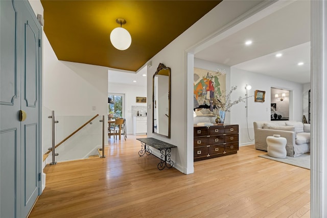 entrance foyer featuring light wood-type flooring, baseboards, and recessed lighting