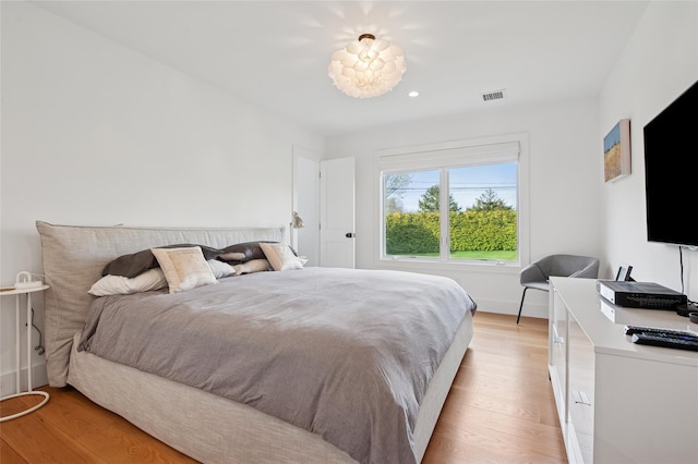 bedroom with light wood-type flooring and recessed lighting