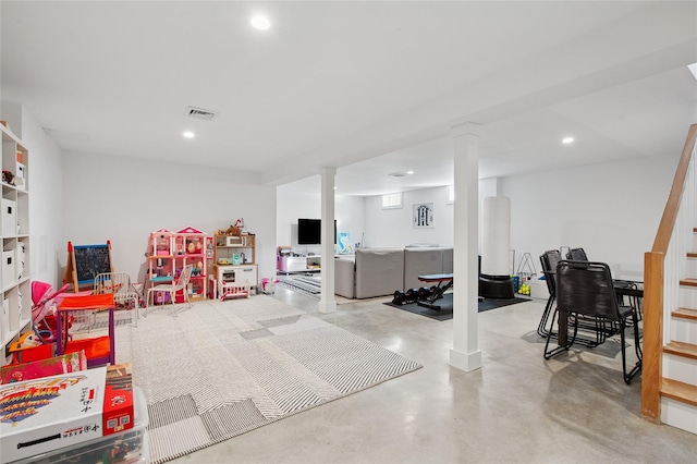 recreation room featuring recessed lighting and finished concrete flooring