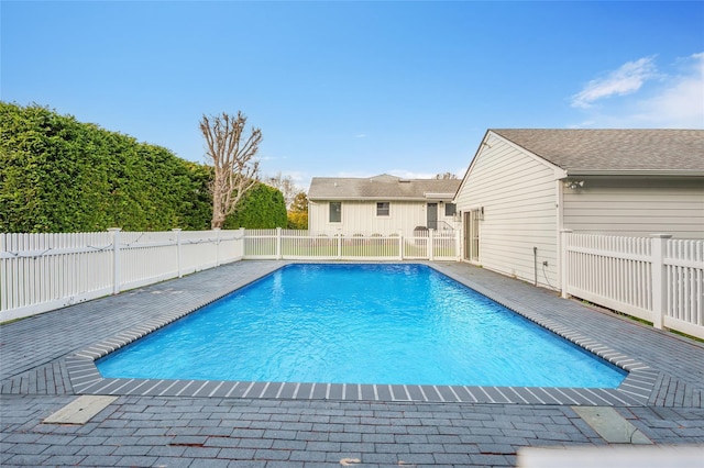 view of swimming pool with fence