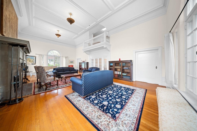 10-08 Shore Rd, Douglaston, NY 11363 - living area with french doors, a high ceiling, wood finished floors, coffered ceiling, and crown molding