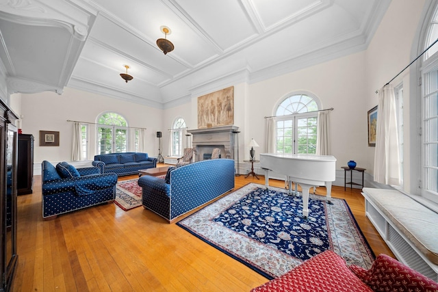 10-08 Shore Rd, Douglaston, NY 11363 - living room featuring healthy amount of natural light, a fireplace, coffered ceiling, hardwood / wood-style floors, and ornamental molding