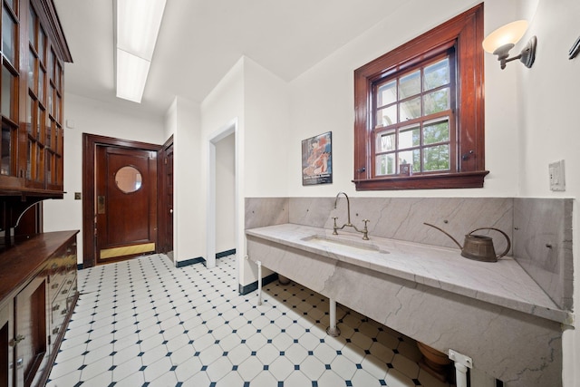 10-08 Shore Rd, Douglaston, NY 11363 - bathroom featuring tile patterned floors, a sink, and baseboards