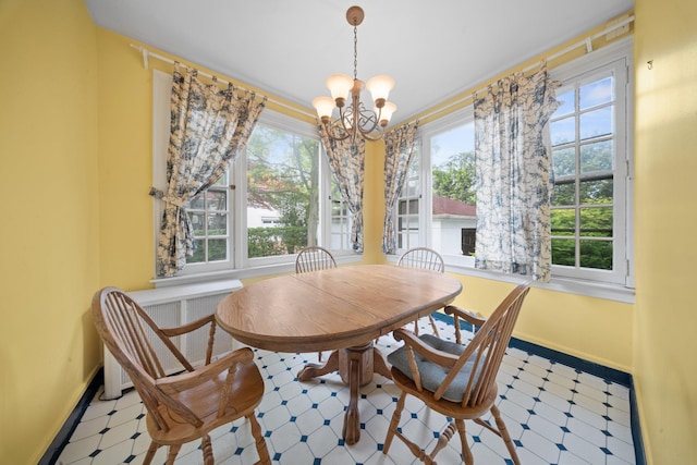 10-08 Shore Rd, Douglaston, NY 11363 - dining room featuring a chandelier, tile patterned floors, and baseboards