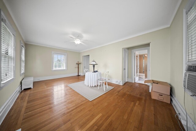 10-08 Shore Rd, Douglaston, NY 11363 - living area featuring hardwood / wood-style flooring, a ceiling fan, crown molding, and baseboards