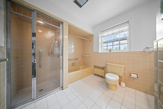 10-08 Shore Rd, Douglaston, NY 11363 - bathroom featuring radiator heating unit, tile walls, tile patterned flooring, a shower stall, and toilet
