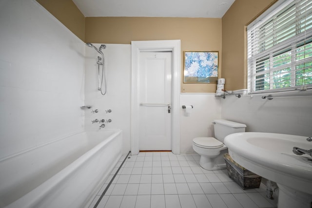 10-08 Shore Rd, Douglaston, NY 11363 - bathroom with toilet, shower / washtub combination, tile patterned flooring, and wainscoting