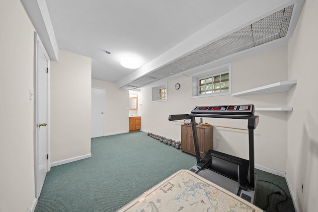 10-08 Shore Rd, Douglaston, NY 11363 - exercise room with baseboards and carpet floors