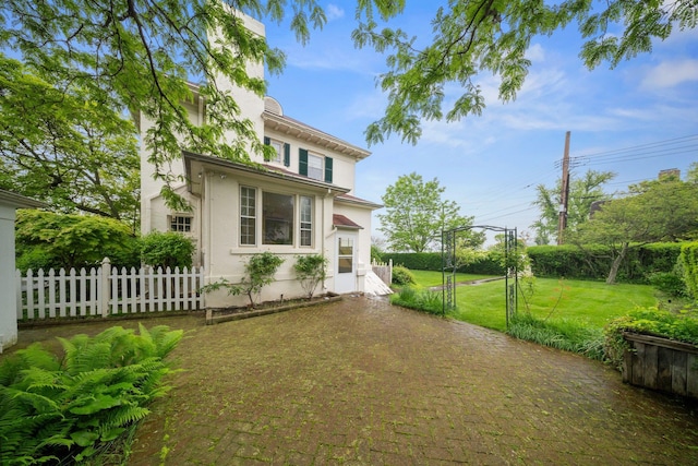 10-08 Shore Rd, Douglaston, NY 11363 - rear view of property featuring stucco siding