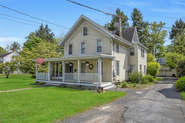 59 E Main St, Washingtonville, NY 10992 - view of front of home with covered porch, a front yard, and a chimney