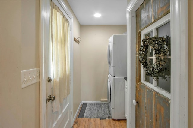 59 E Main St, Washingtonville, NY 10992 - clothes washing area with stacked washer / drying machine, light wood finished floors, and baseboards