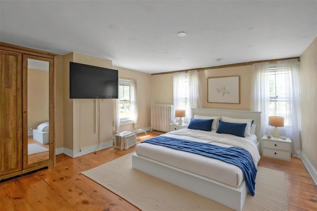 59 E Main St, Washingtonville, NY 10992 - bedroom with radiator, light wood finished floors, and baseboards