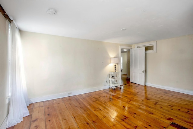 59 E Main St, Washingtonville, NY 10992 - spare room with a smoke detector, wood-type flooring, and baseboards