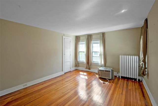 59 E Main St, Washingtonville, NY 10992 - empty room featuring radiator heating unit, hardwood / wood-style floors, and baseboards