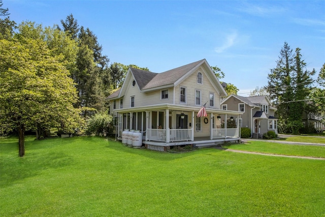 59 E Main St, Washingtonville, NY 10992 - view of front facade with a porch and a front lawn
