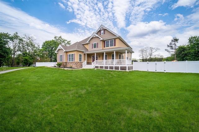 view of front of property with covered porch and a gate