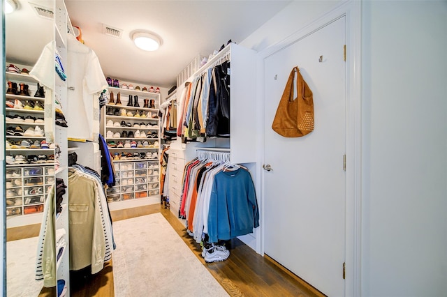 spacious closet featuring wood finished floors