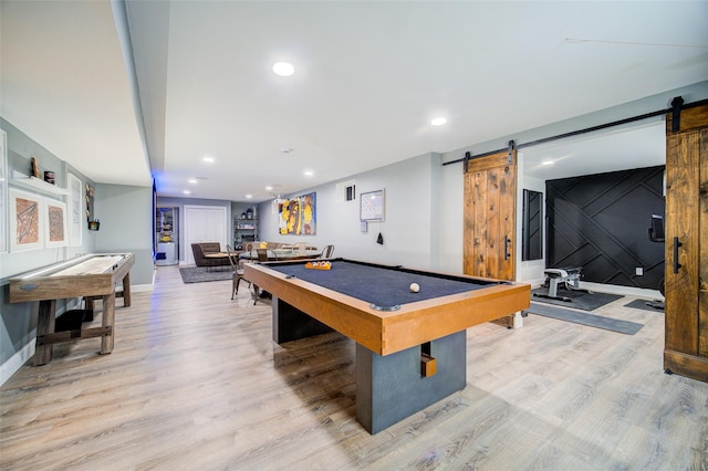 game room with a barn door, billiards table, light wood-type flooring, baseboards, and recessed lighting