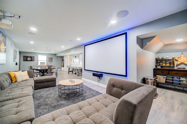 cinema featuring wood finished floors, recessed lighting, and baseboards