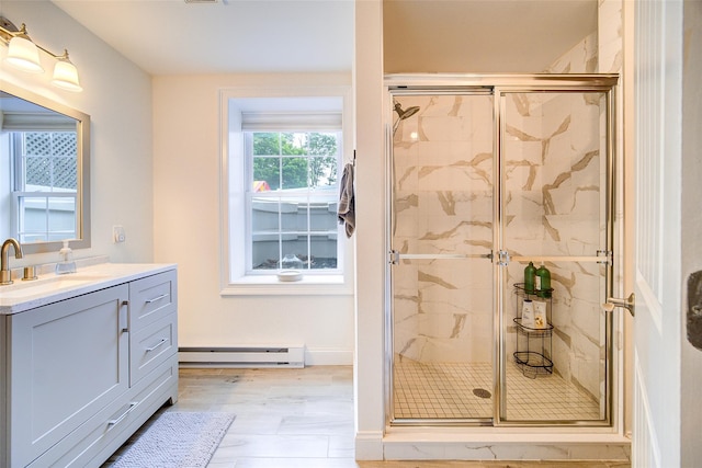 full bath featuring a baseboard heating unit, a marble finish shower, and vanity