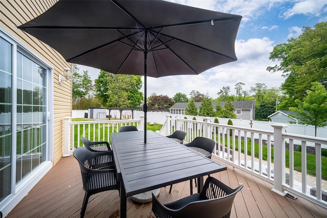 deck with outdoor dining space