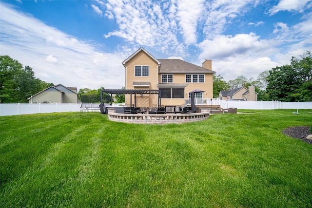 rear view of property featuring a chimney, a patio, and a deck