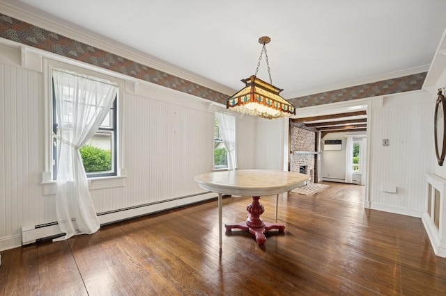 2600 Garden St, Baldwin, NY 11510 - dining area with wood-type flooring, a fireplace, crown molding, and a wall mounted AC