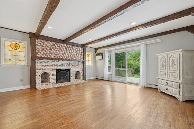 2600 Garden St, Baldwin, NY 11510 - unfurnished living room with beamed ceiling, wood finished floors, a brick fireplace, a baseboard heating unit, and baseboards