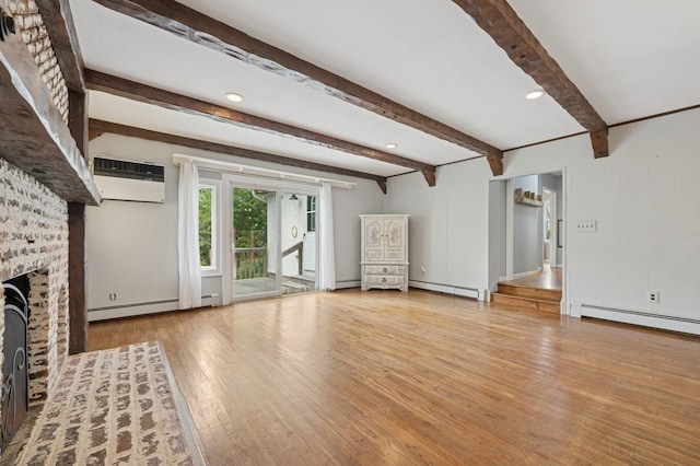 2600 Garden St, Baldwin, NY 11510 - unfurnished living room with a baseboard heating unit, a wall mounted air conditioner, wood finished floors, a fireplace, and beamed ceiling