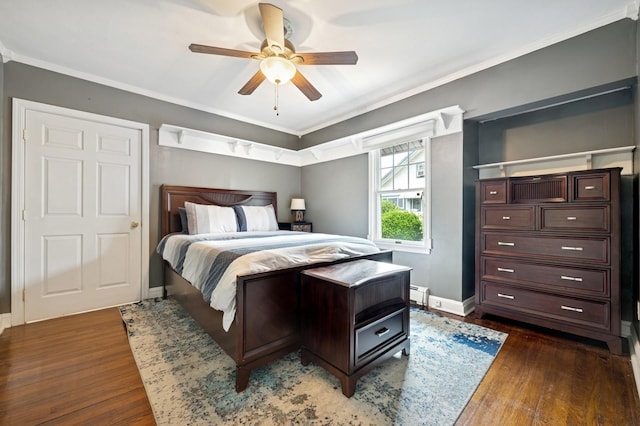 2600 Garden St, Baldwin, NY 11510 - bedroom featuring wood finished floors, baseboards, crown molding, ceiling fan, and a baseboard radiator