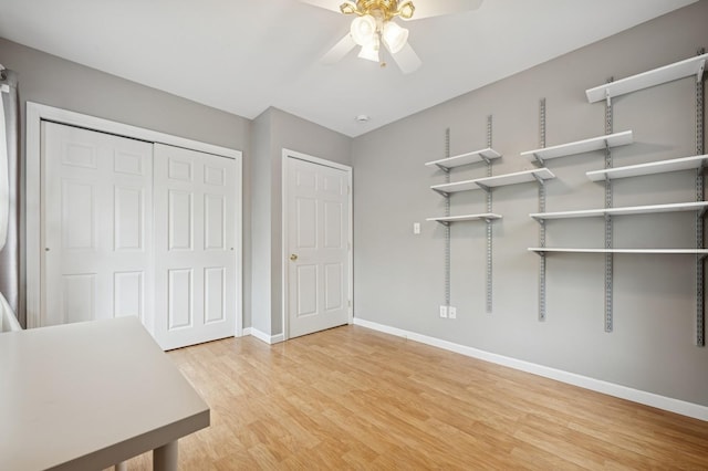 2600 Garden St, Baldwin, NY 11510 - unfurnished office with ceiling fan, baseboards, and light wood-style flooring