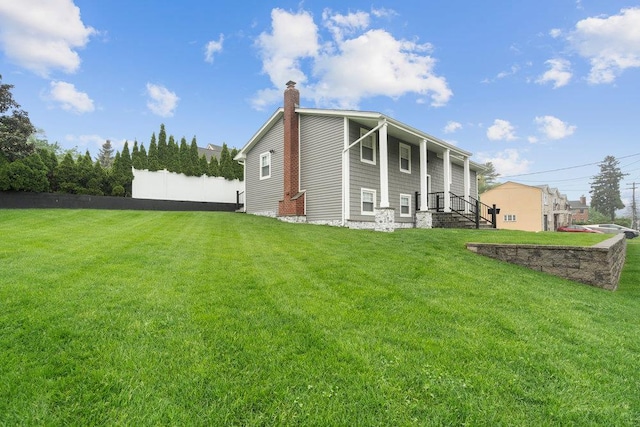 181 Central Park Rd E, Plainview, NY 11803 - rear view of house with a chimney
