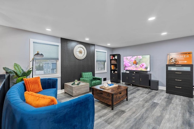 181 Central Park Rd E, Plainview, NY 11803 - living area with wood finished floors, recessed lighting, and baseboards