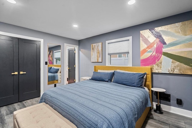 181 Central Park Rd E, Plainview, NY 11803 - bedroom featuring wood finished floors, recessed lighting, a closet, and baseboards