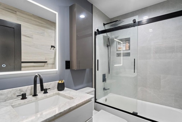 181 Central Park Rd E, Plainview, NY 11803 - bathroom featuring toilet, shower / bath combination with glass door, and vanity