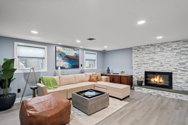 181 Central Park Rd E, Plainview, NY 11803 - living room with light wood-style floors, a fireplace, and recessed lighting