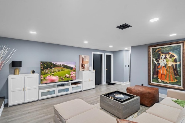 181 Central Park Rd E, Plainview, NY 11803 - cinema with light wood-style flooring, recessed lighting, and baseboards