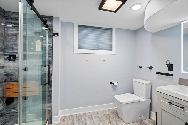 181 Central Park Rd E, Plainview, NY 11803 - bathroom with a stall shower, baseboards, toilet, and wood finished floors