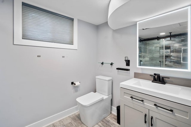 181 Central Park Rd E, Plainview, NY 11803 - bathroom featuring a shower stall, wood finished floors, toilet, baseboards, and vanity