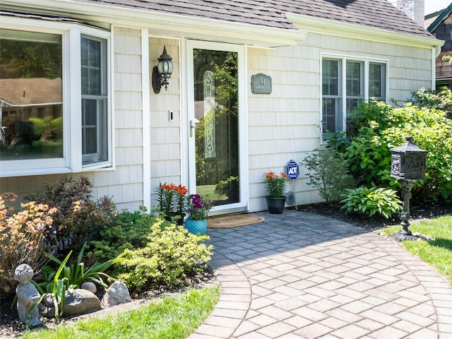 94 Shadyside Ave, Port Washington, NY 11050 - property entrance featuring a shingled roof