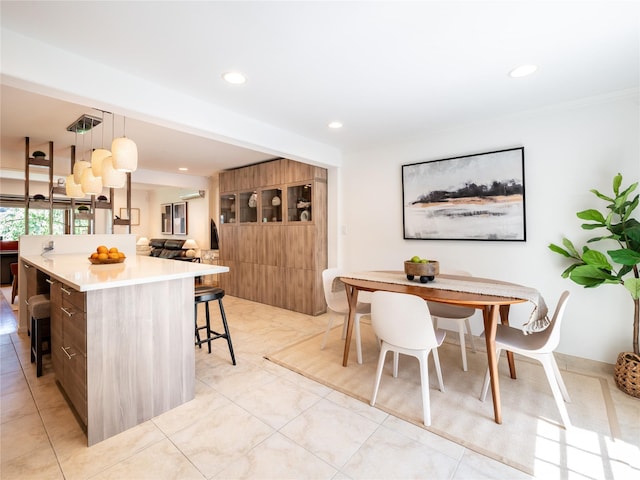 94 Shadyside Ave, Port Washington, NY 11050 - kitchen with modern cabinets, a breakfast bar, a center island, recessed lighting, and light countertops
