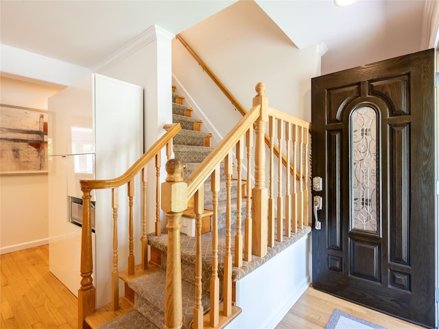94 Shadyside Ave, Port Washington, NY 11050 - entryway featuring wood finished floors, stairway, and baseboards