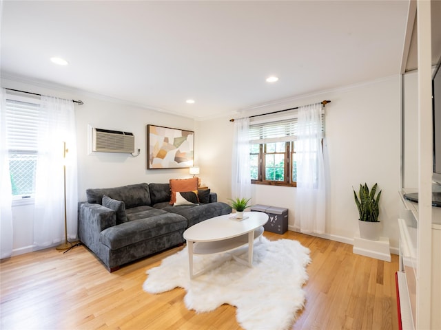 94 Shadyside Ave, Port Washington, NY 11050 - living room with crown molding, light wood finished floors, an AC wall unit, recessed lighting, and baseboards